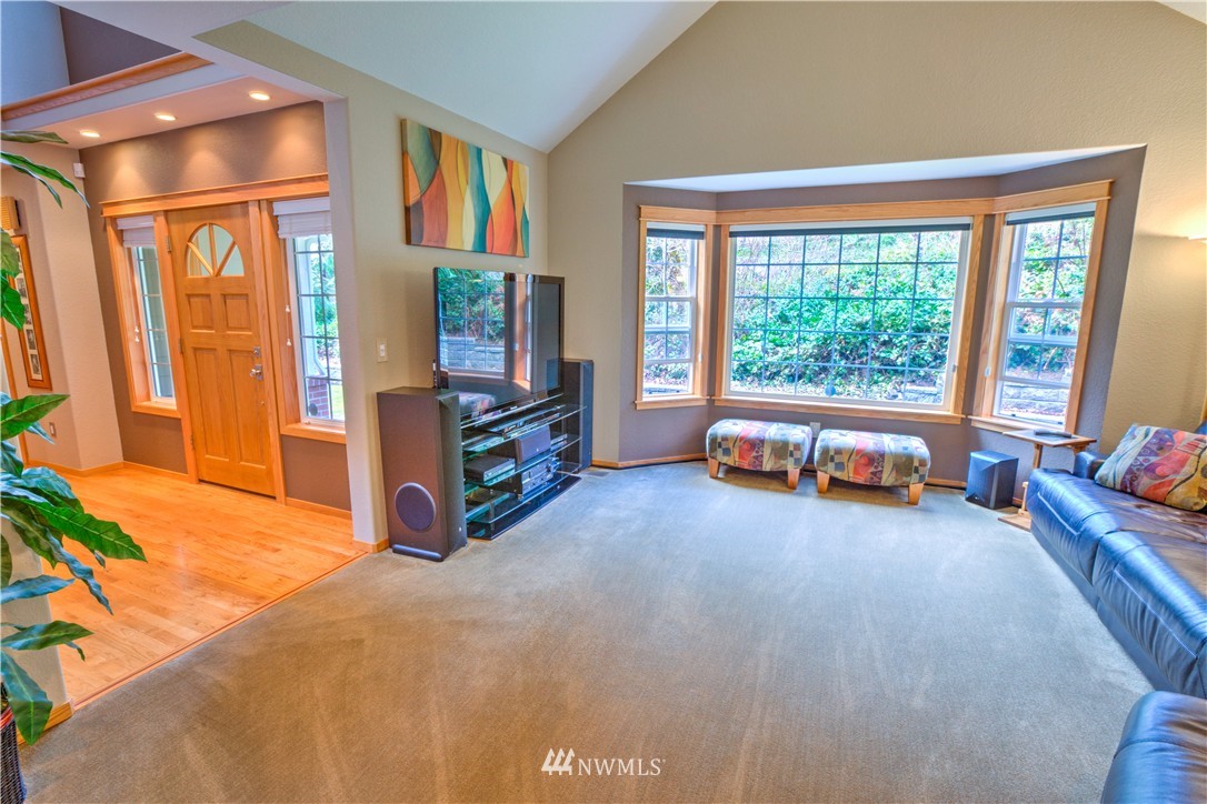 7736 Fairview Road Southwest Tumwater, WA 98512 - Photo 5 of 25 a living room with furniture and a large window