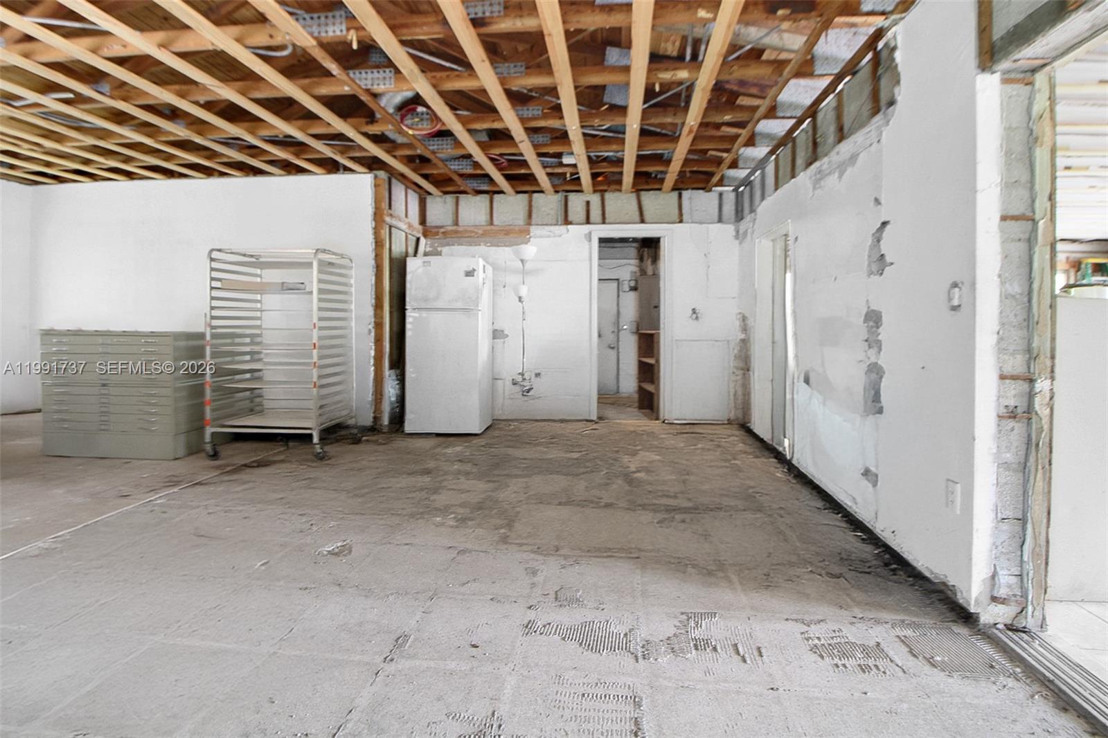 8285 Southwest 104th Street Miami, FL 33156 - Photo 17 of 21 a view of an empty room with white walls
