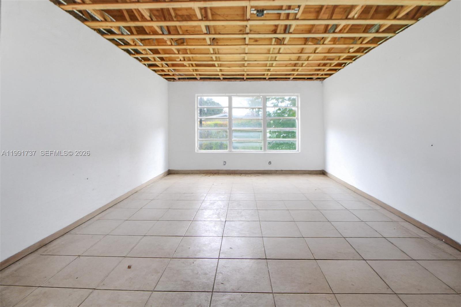 8285 Southwest 104th Street Miami, FL 33156 - Photo 19 of 21 a view of an empty room with a window
