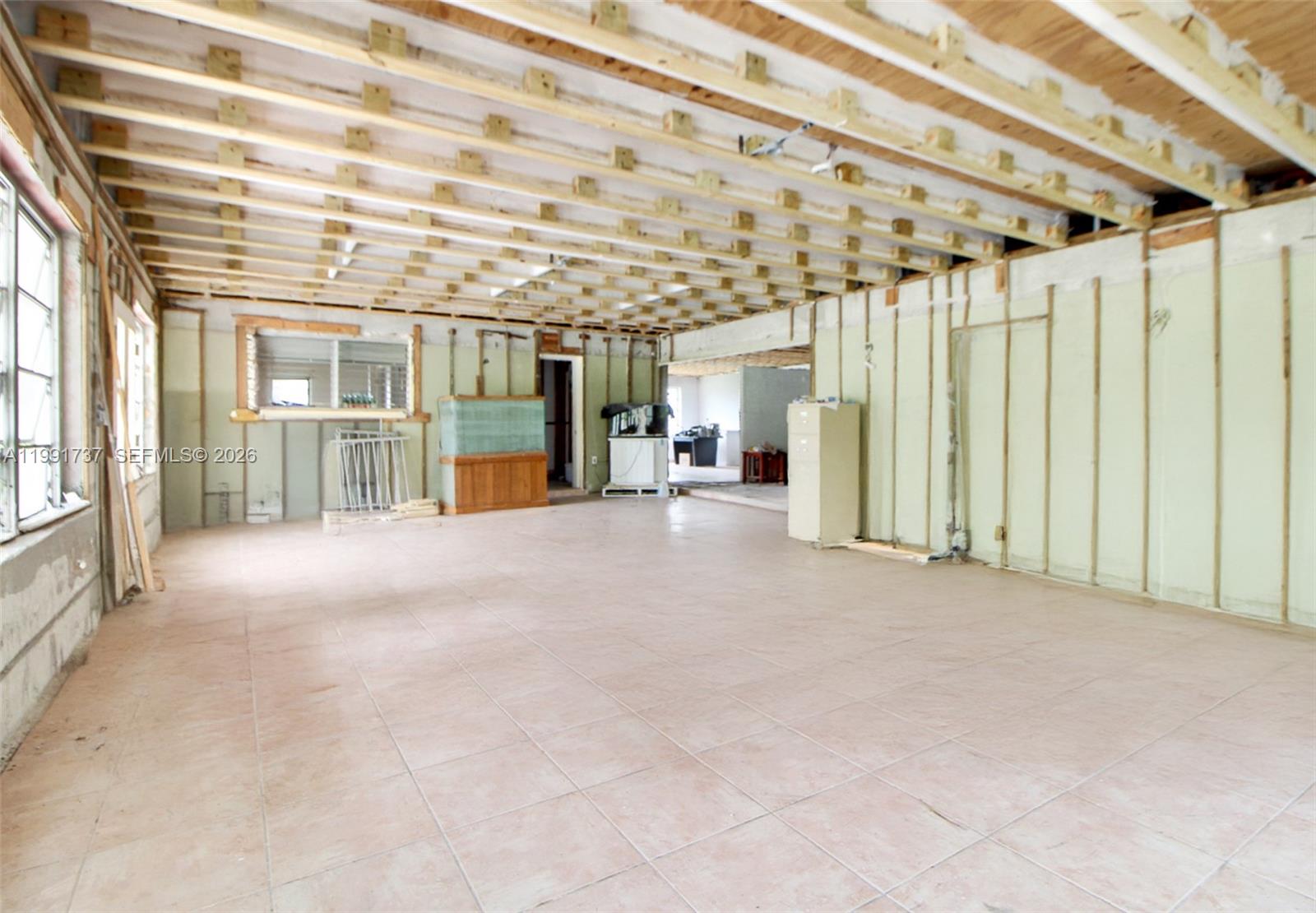 8285 Southwest 104th Street Miami, FL 33156 - Photo 20 of 21 a view of an empty room with a window