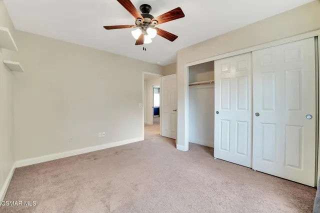 a view of a house with swimming pool and sitting area