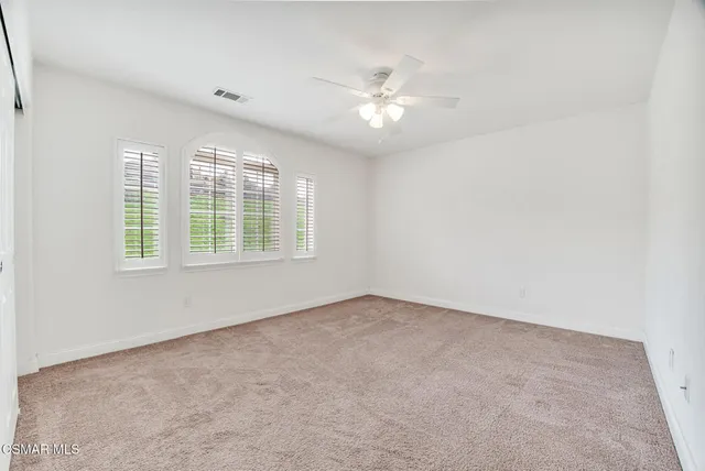 a view of a swimming pool with an outdoor seating