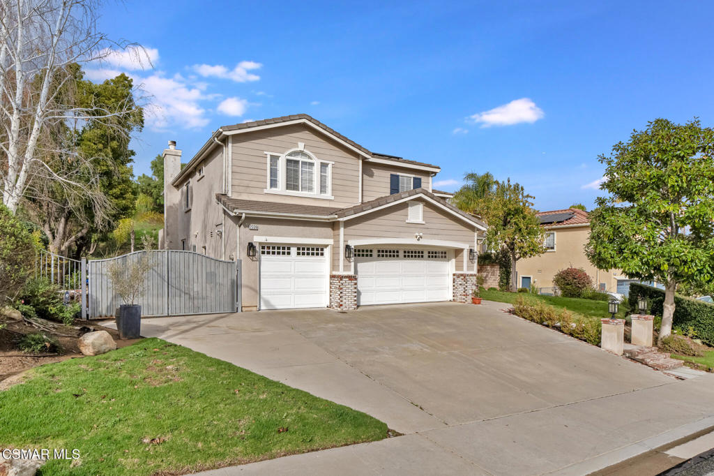 2339 Rudolph Drive Simi Valley, CA 93065 - Photo 56 of 60 a front view of a house with a yard and garage