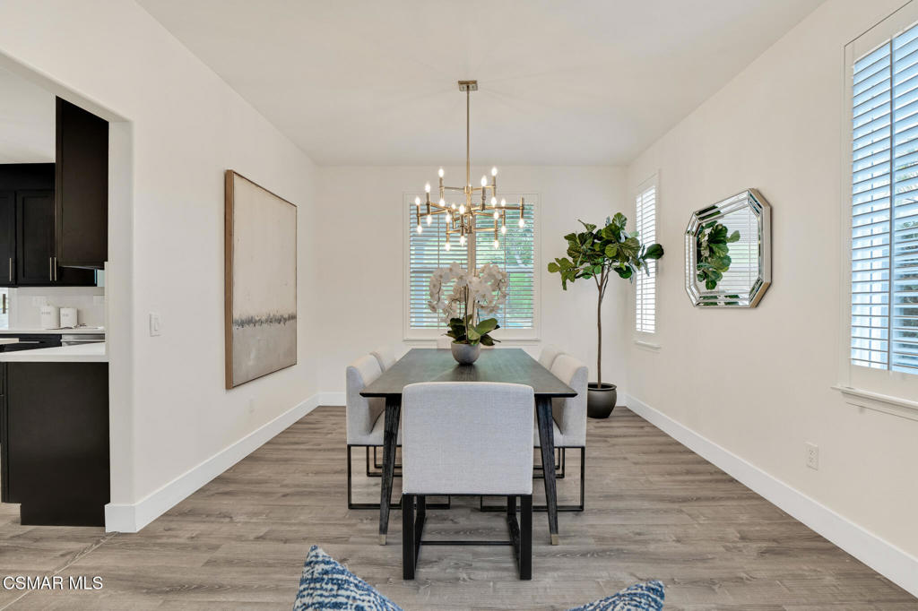 2339 Rudolph Drive Simi Valley, CA 93065 - Photo 10 of 60 a dining room with furniture potted plants and wooden floor