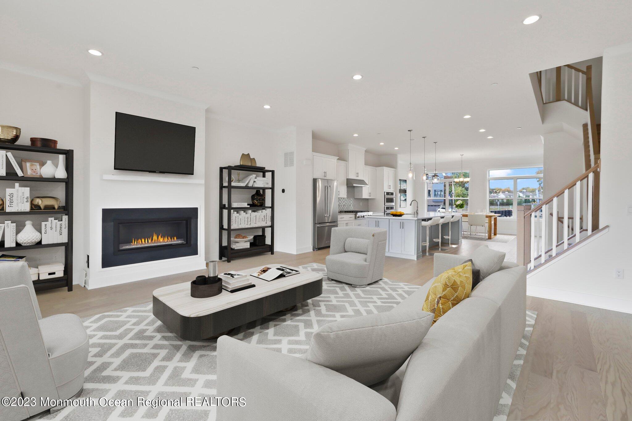 3 Valiant Court Middletown, NJ 07748 - Photo 13 of 42 a living room with furniture fireplace and a flat screen tv