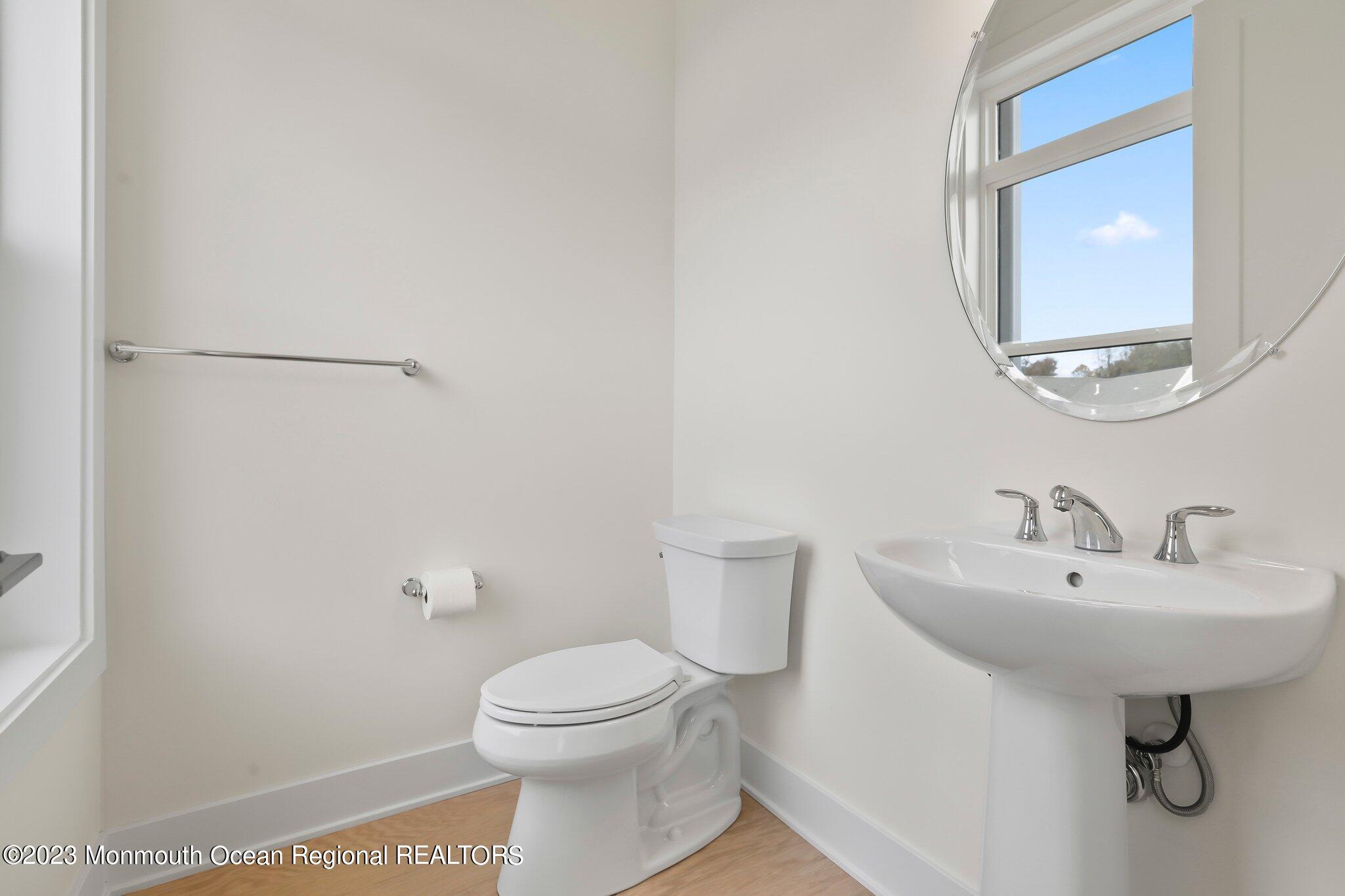 3 Valiant Court Middletown, NJ 07748 - Photo 14 of 42 a bathroom with a sink a toilet and mirror