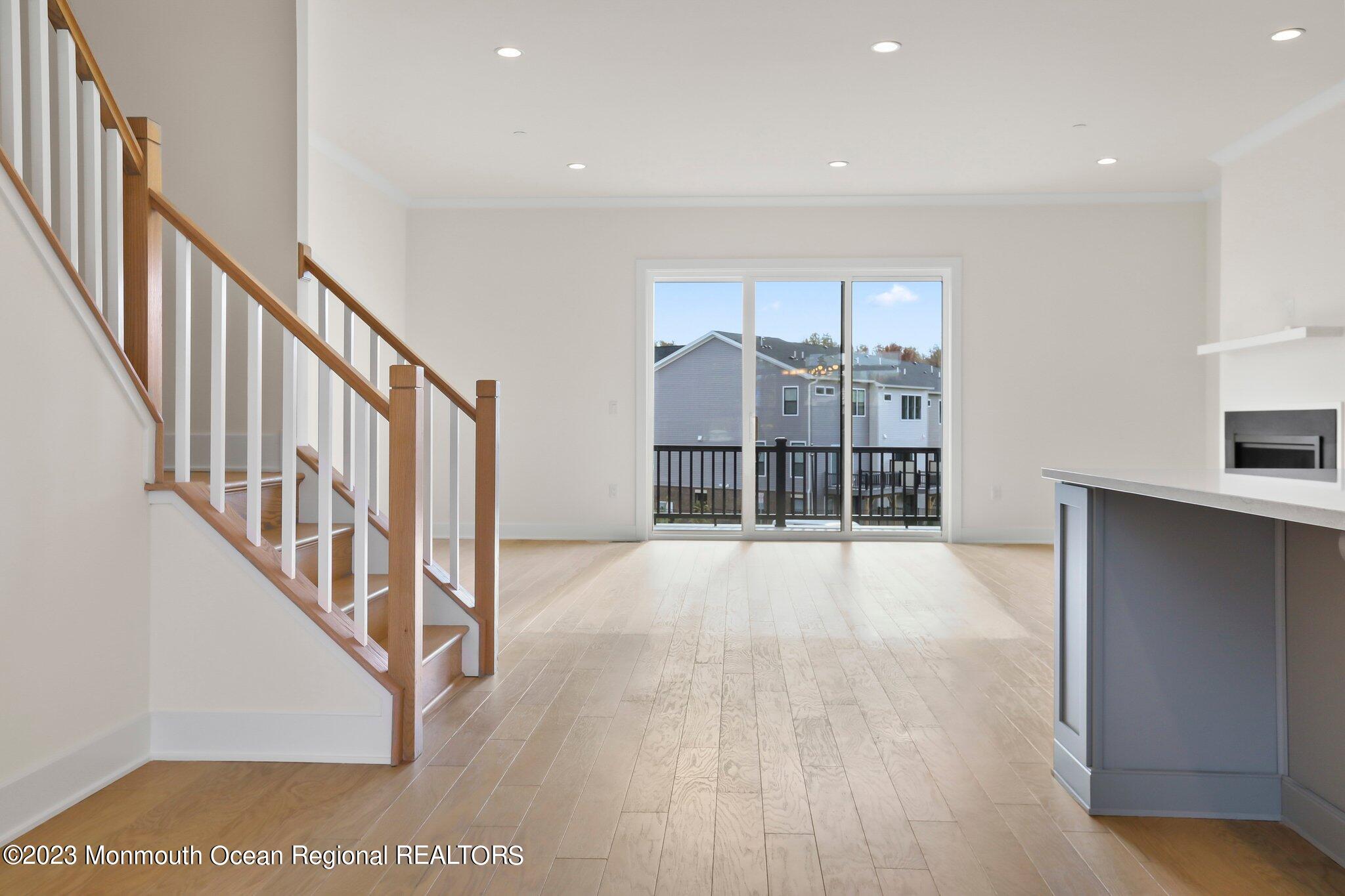 3 Valiant Court Middletown, NJ 07748 - Photo 15 of 42 a view of an empty room with wooden floor and a window