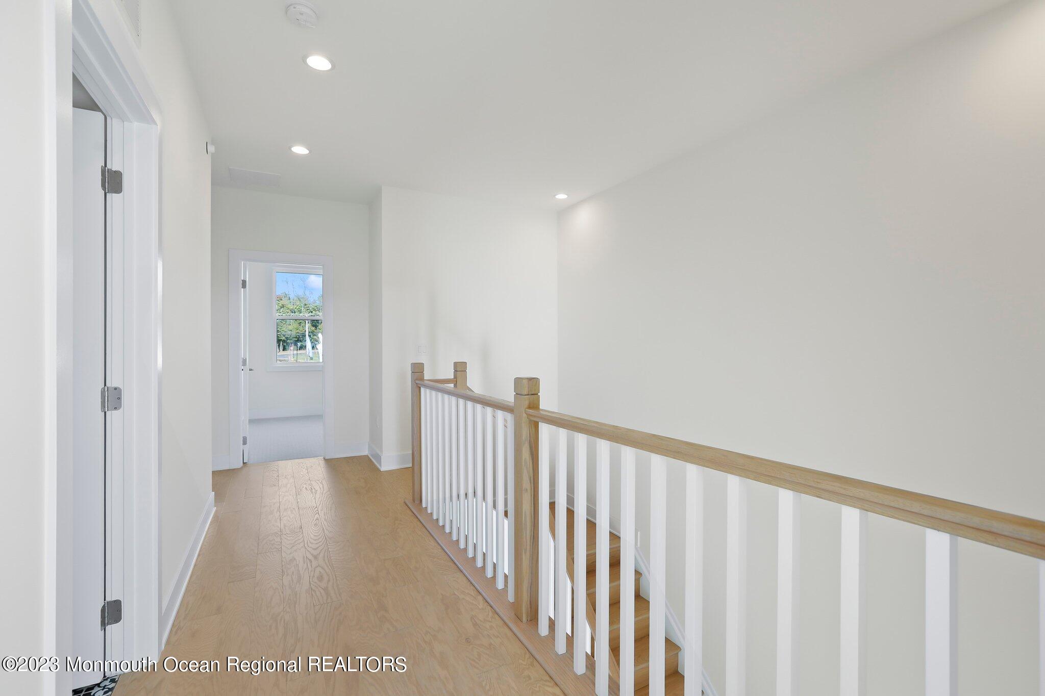 3 Valiant Court Middletown, NJ 07748 - Photo 19 of 42 a view of a hallway with wooden floor