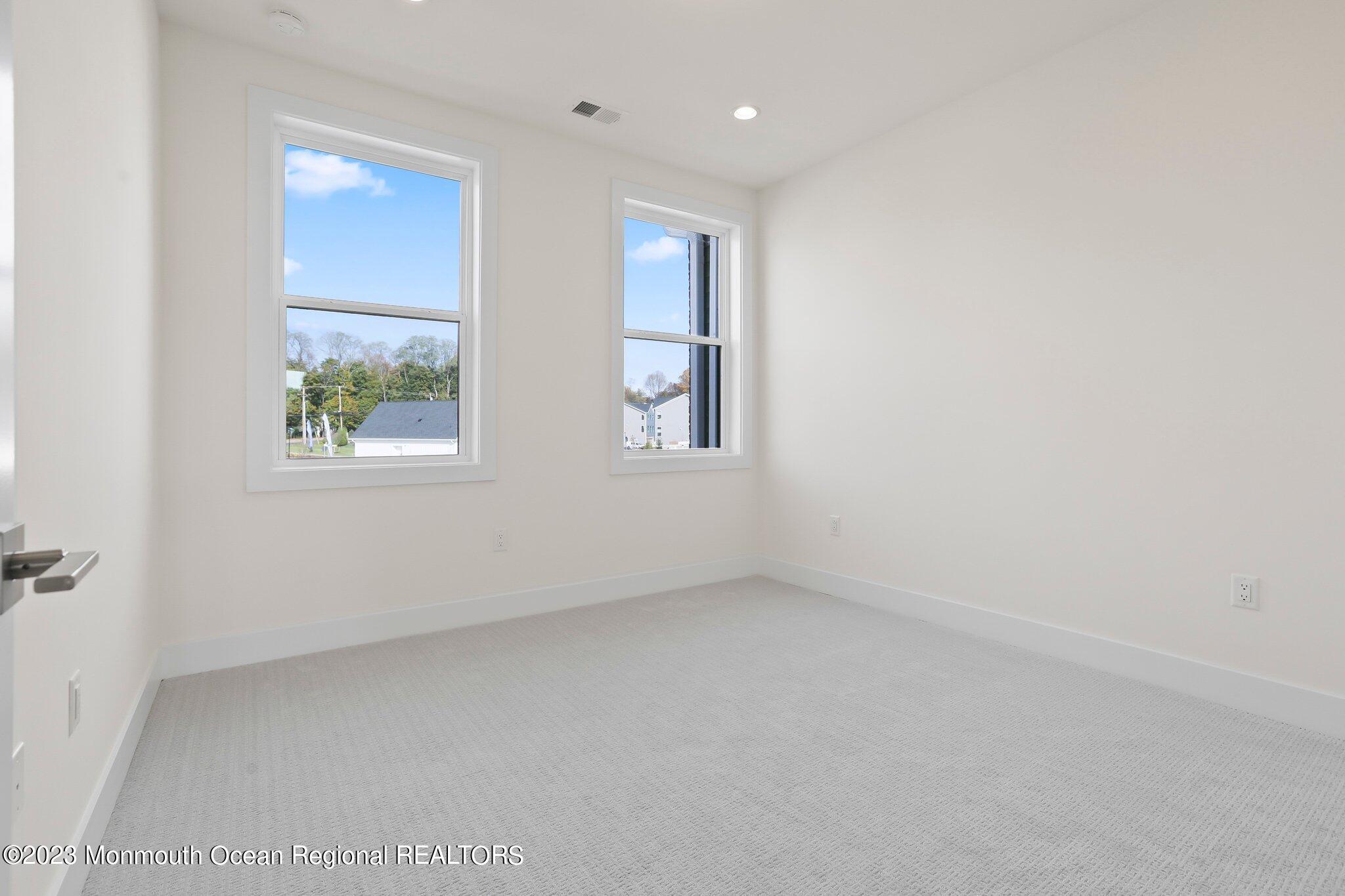 3 Valiant Court Middletown, NJ 07748 - Photo 26 of 42 an empty room with windows
