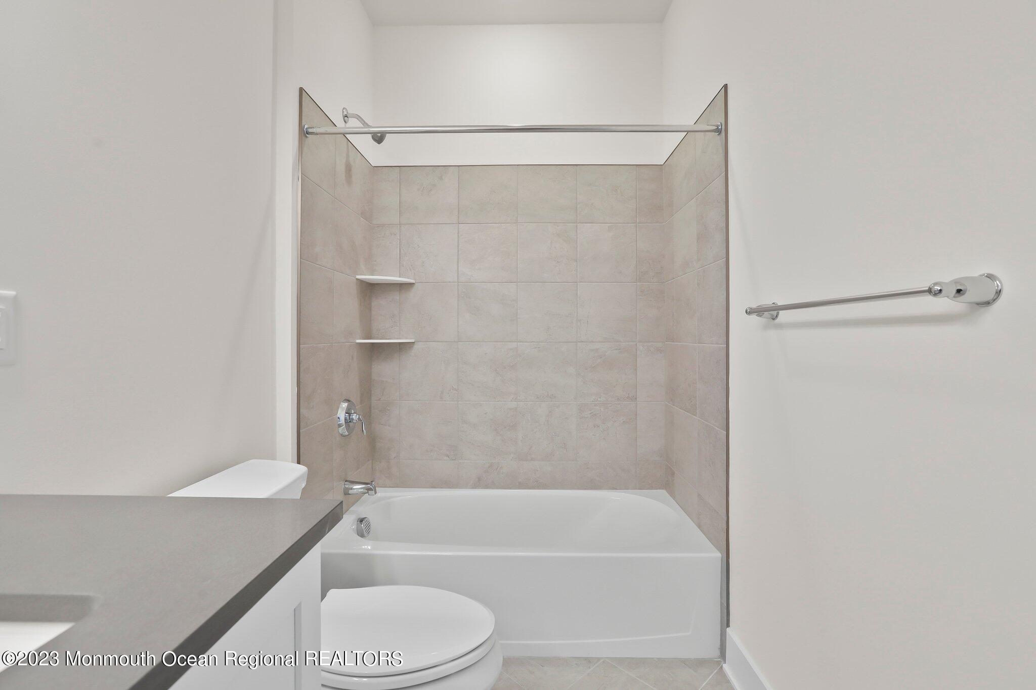 3 Valiant Court Middletown, NJ 07748 - Photo 28 of 42 a bathroom with a shower and a toilet