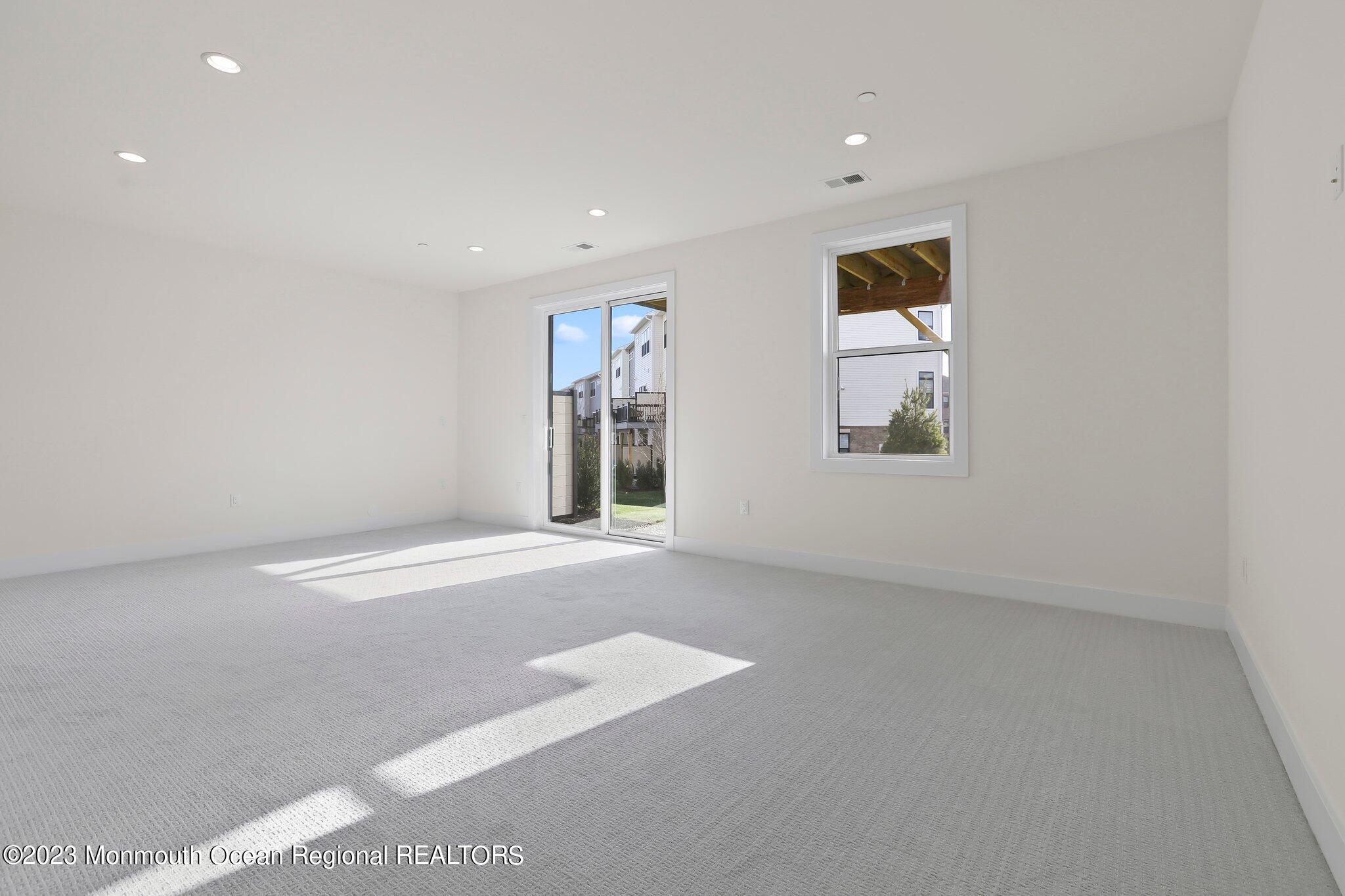 3 Valiant Court Middletown, NJ 07748 - Photo 33 of 42 an empty room with windows