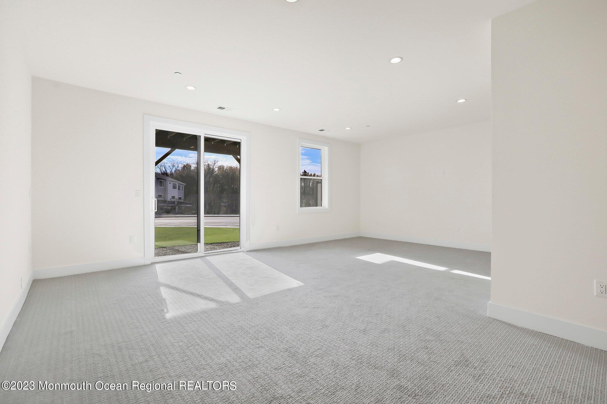 3 Valiant Court Middletown, NJ 07748 - Photo 34 of 42 an empty room with windows and pillars in it