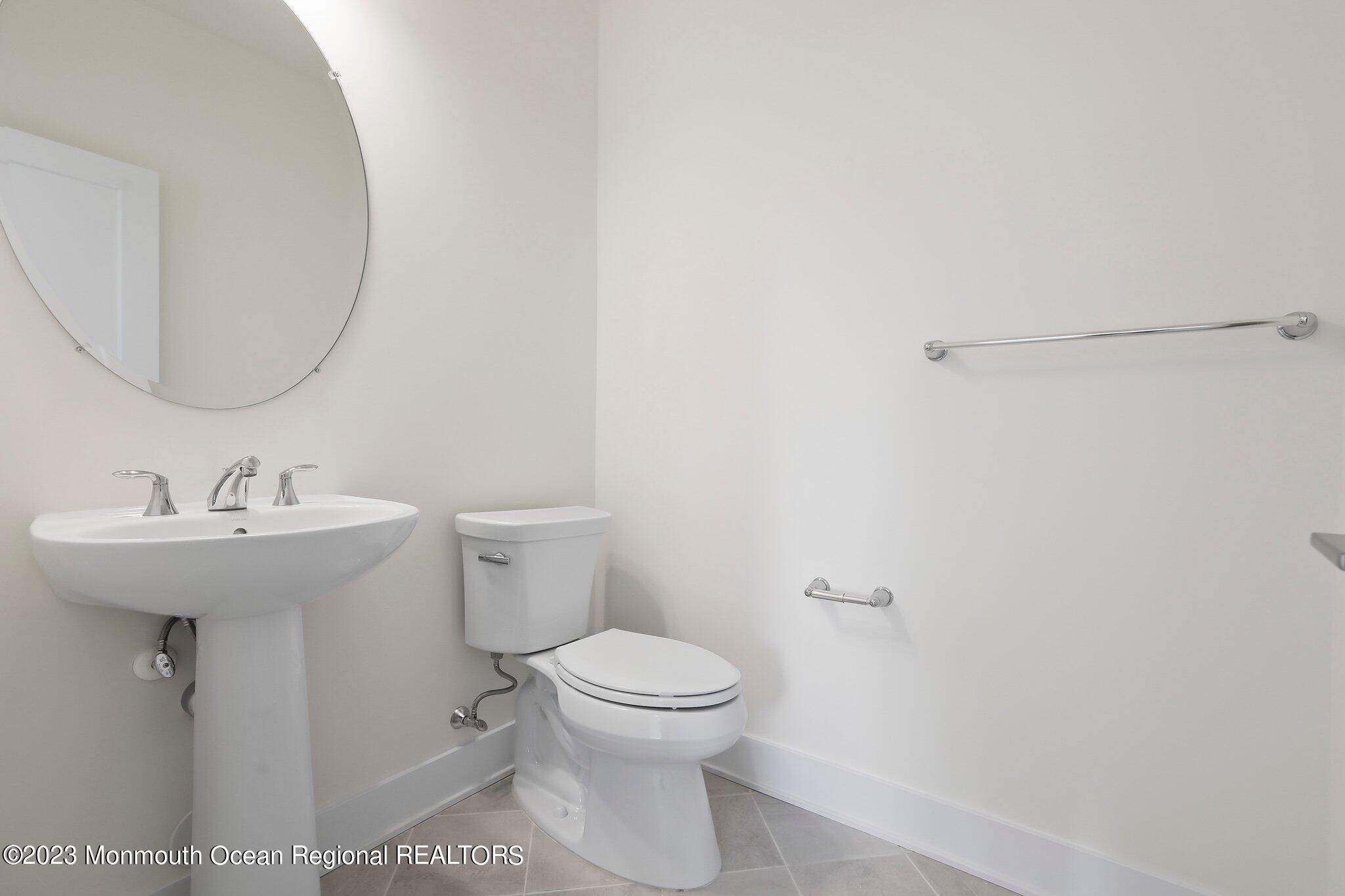 3 Valiant Court Middletown, NJ 07748 - Photo 36 of 42 a bathroom with a toilet sink and mirror