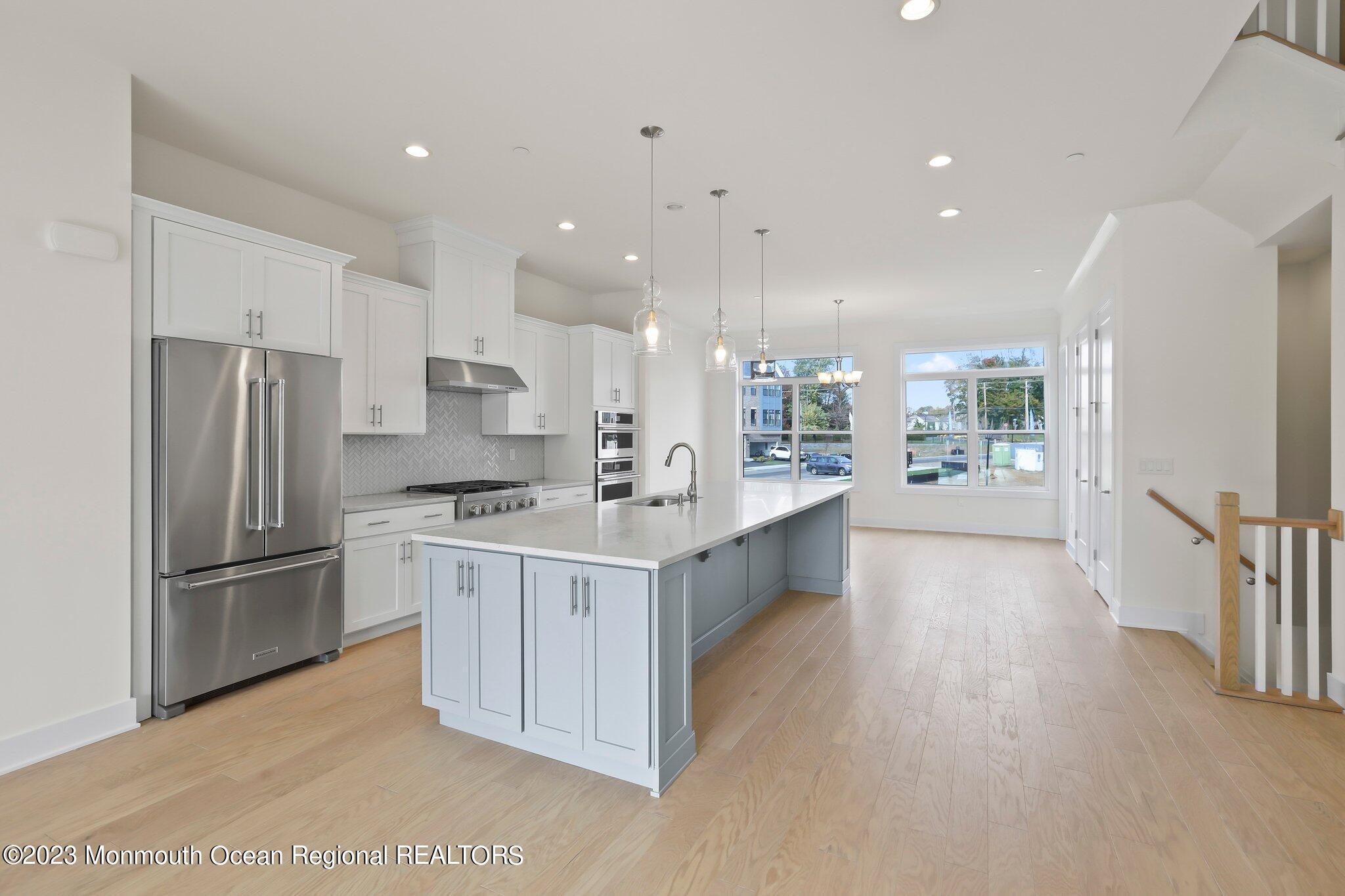 3 Valiant Court Middletown, NJ 07748 - Photo 4 of 42 a kitchen with kitchen island a sink stainless steel appliances and cabinets