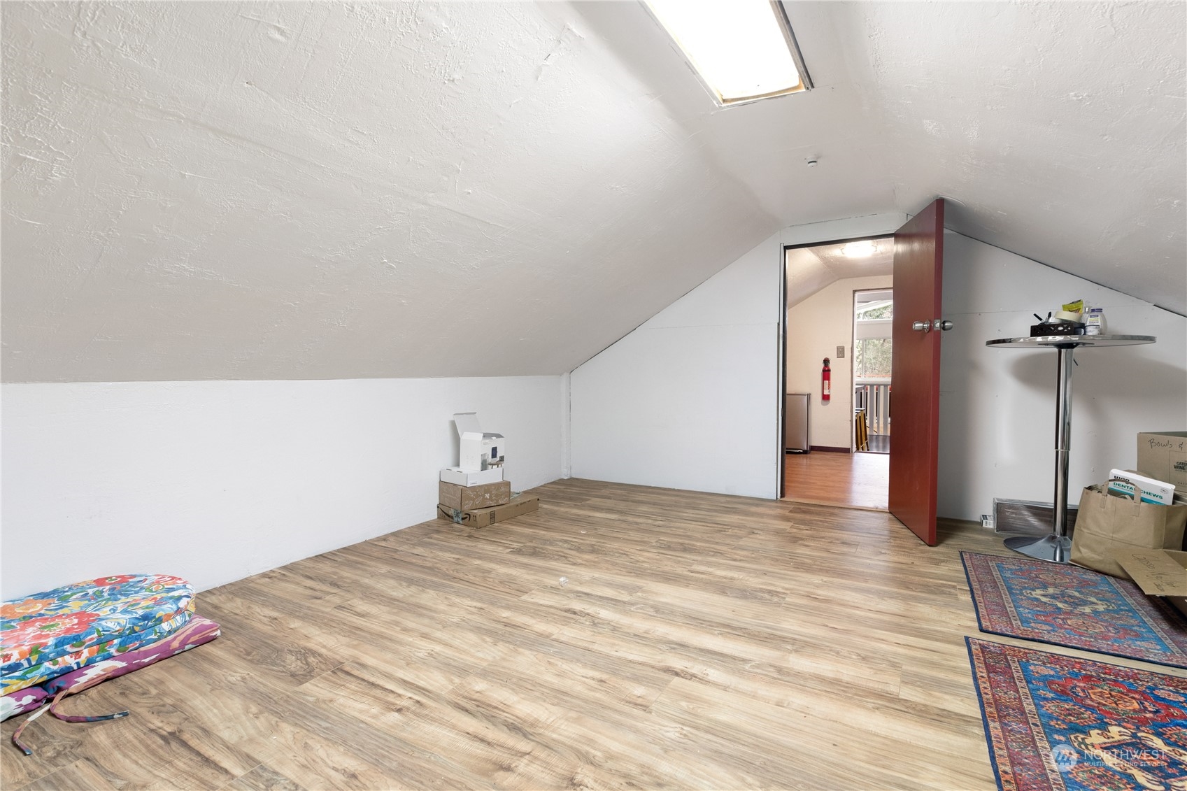 170 Denneboom Road Coupeville, WA 98239 - Photo 13 of 39 a view of a bedroom with a bed and wooden floor