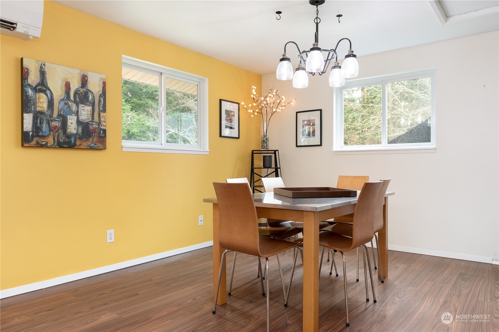170 Denneboom Road Coupeville, WA 98239 - Photo 15 of 39 a view of a dining room with furniture wooden floor and a chandelier