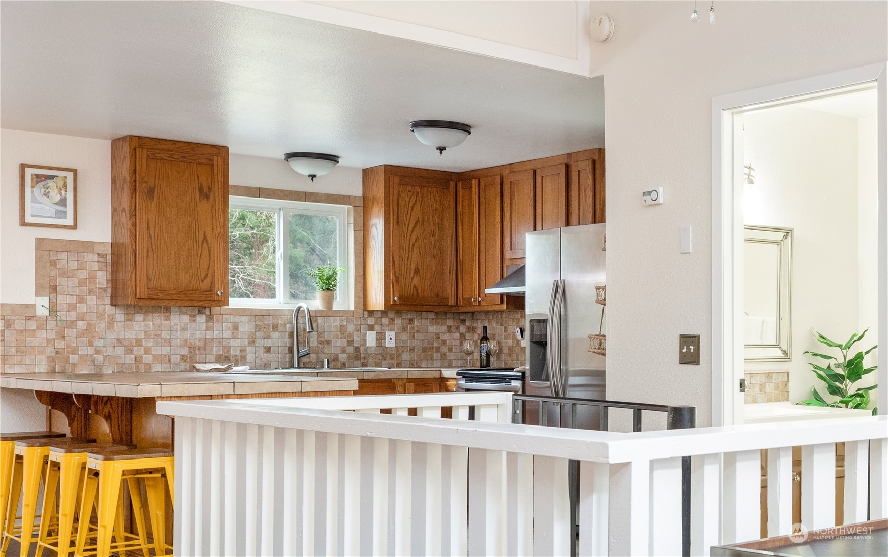 170 Denneboom Road Coupeville, WA 98239 - Photo 18 of 39 a bathroom with a granite countertop sink and a mirror