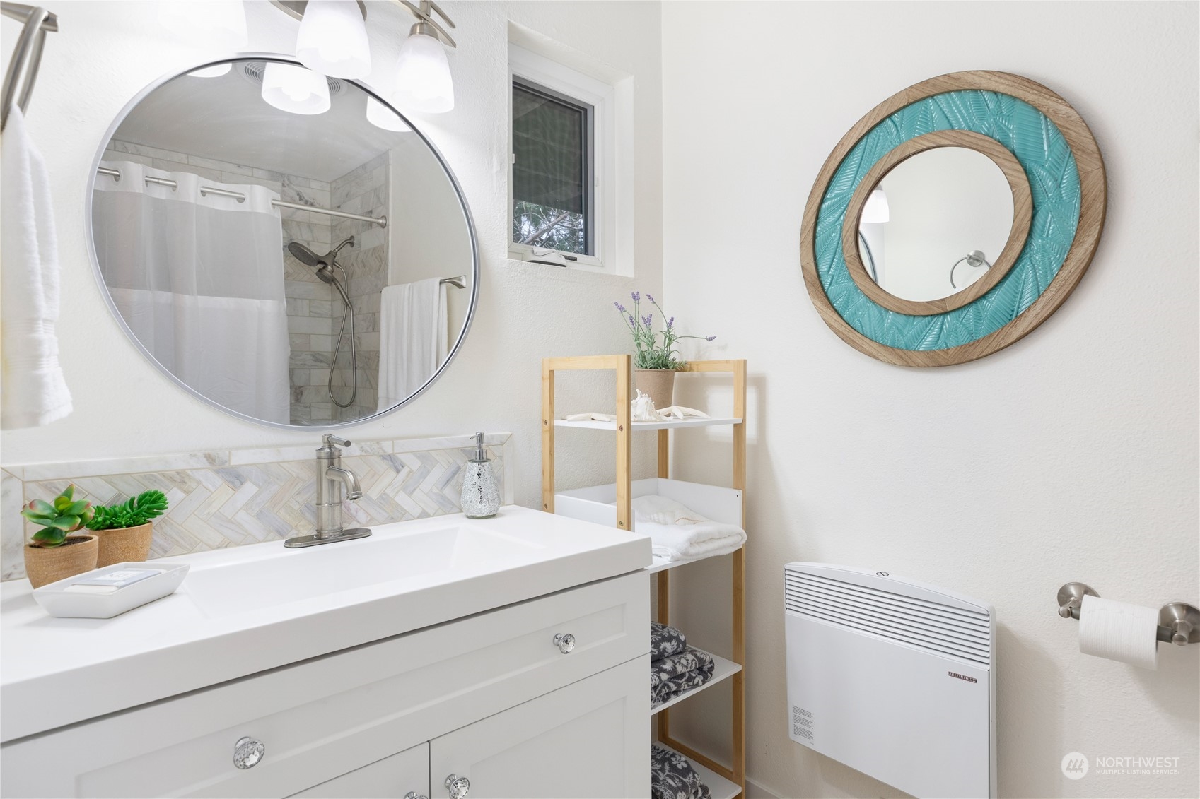 170 Denneboom Road Coupeville, WA 98239 - Photo 23 of 39 a bathroom with a sink and a mirror