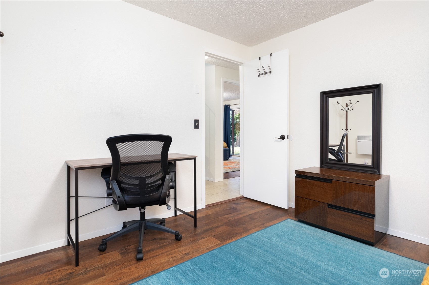 170 Denneboom Road Coupeville, WA 98239 - Photo 28 of 39 a view of room with wooden floor lounge chair and windows