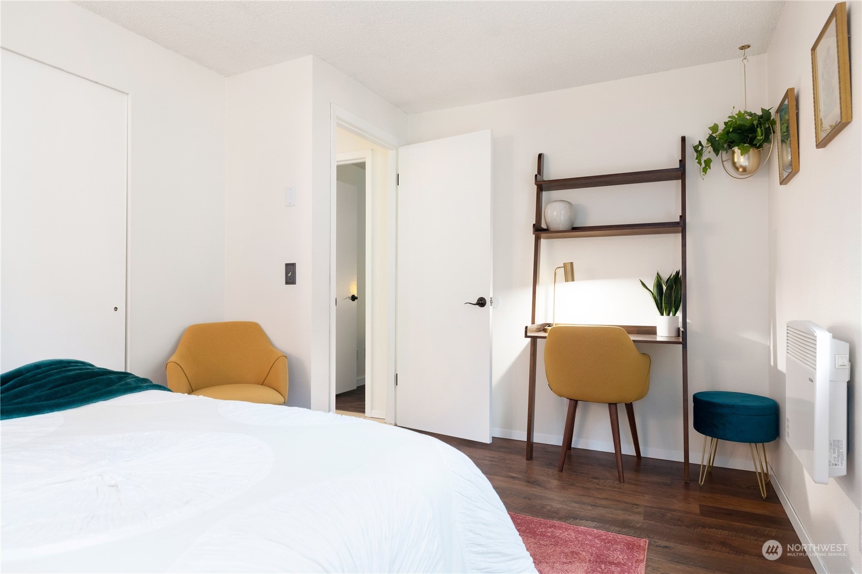 170 Denneboom Road Coupeville, WA 98239 - Photo 30 of 39 a bedroom with a bed and a chair