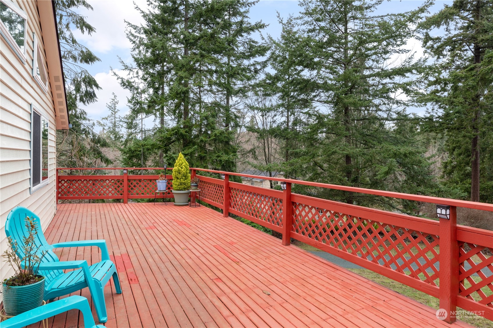 170 Denneboom Road Coupeville, WA 98239 - Photo 36 of 39 a balcony with wooden floor and outdoor seating
