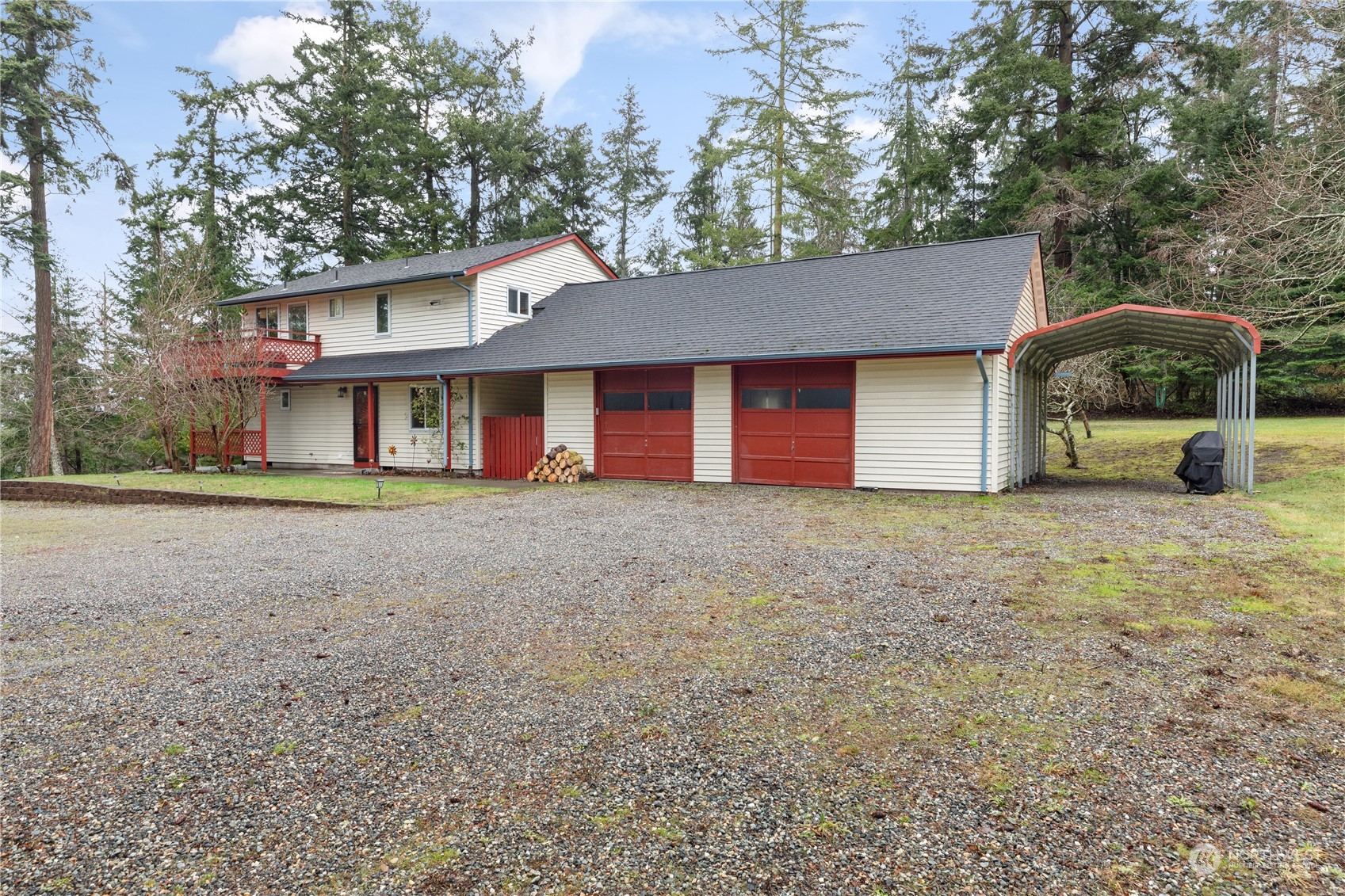 170 Denneboom Road Coupeville, WA 98239 - Photo 4 of 39 a front view of a house with a yard and garage