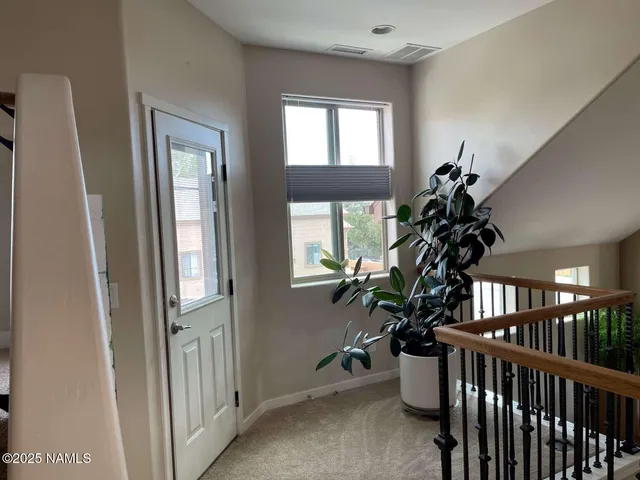 a view of a porch with furniture and a window
