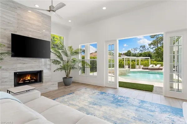 a view of a house with backyard sitting area and garden