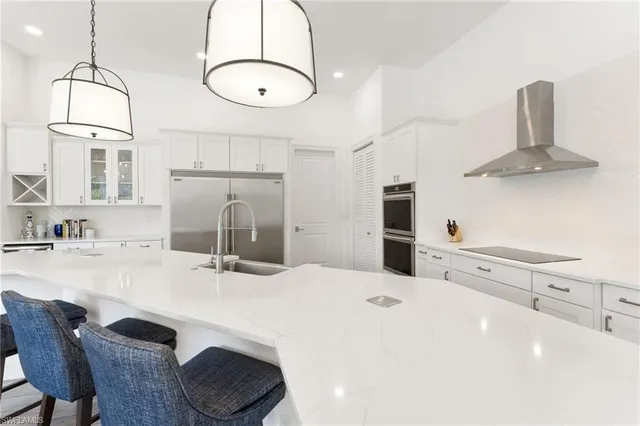 a bathroom with double vanity sink and a mirror