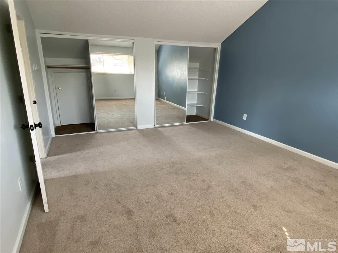 1107 Frontier Court Reno, NV 89503 - Photo 3 of 15 an empty room with mirror and entrance