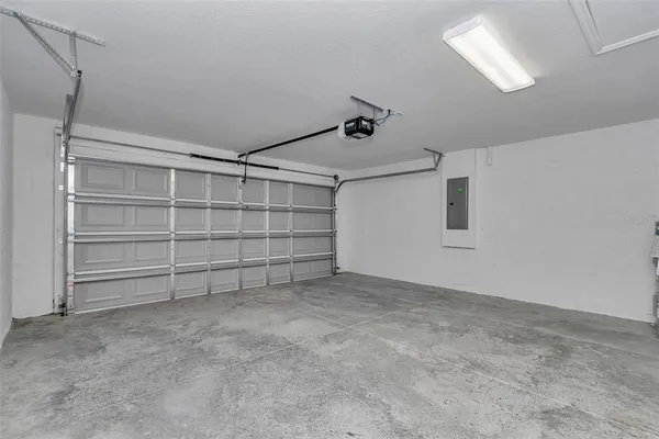 a view of an empty room with closet and racks