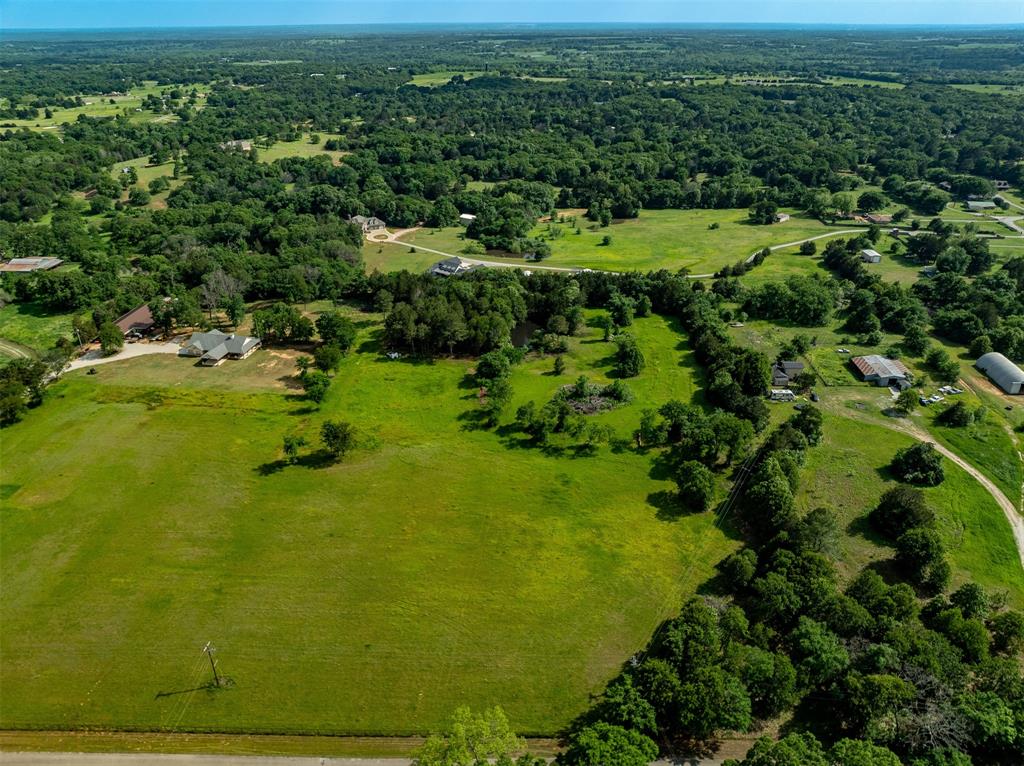 Tbd Cleve Cole Road Denison, TX 75021 - Photo 2 of 10 a view of a green yard with large trees