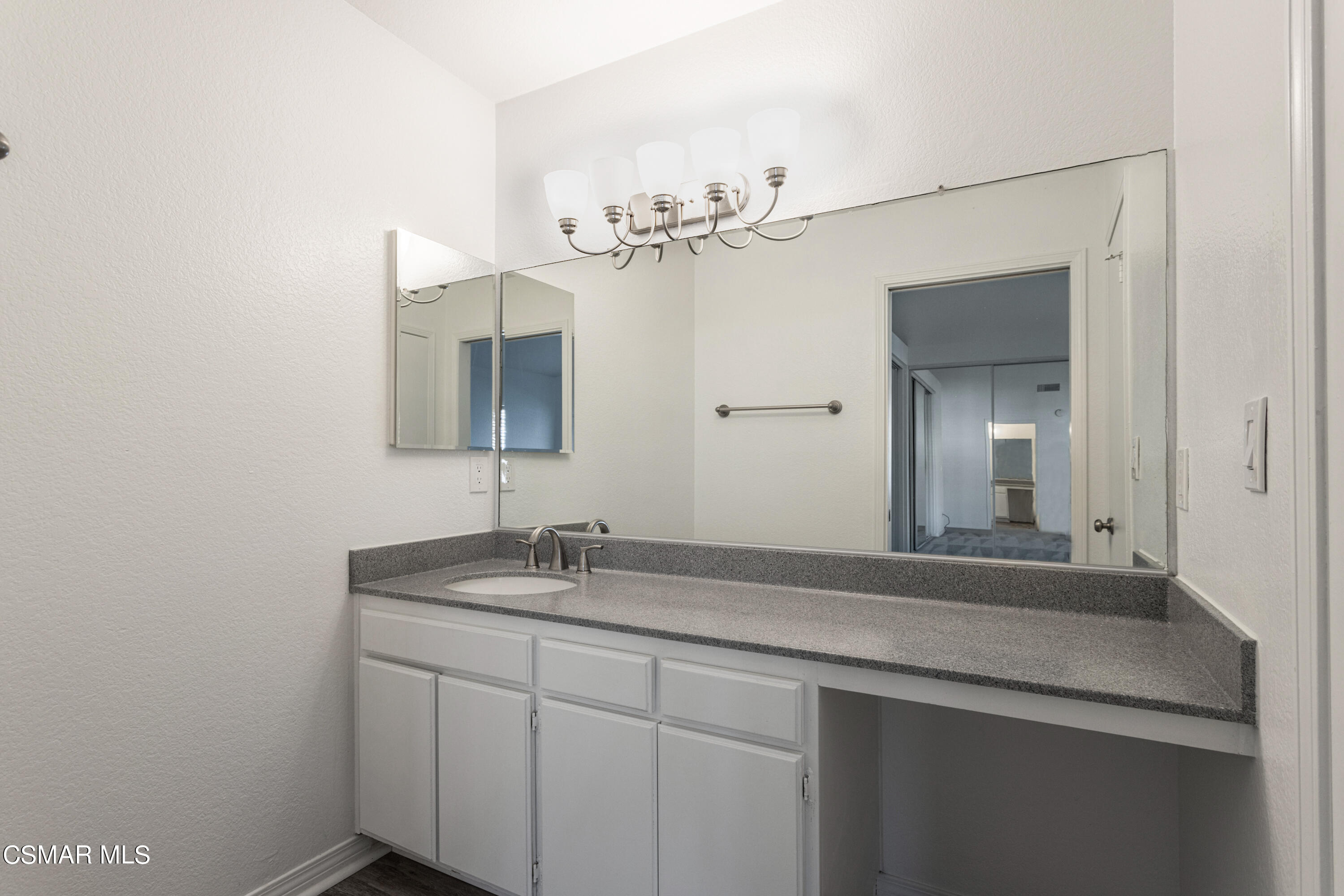1962 Rory Lane, Unit 2 Simi Valley, CA 93063 - Photo 12 of 21 a bathroom with a sink and a mirror