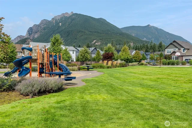 a view of a park with houses