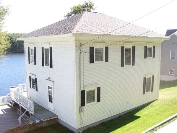 7 South Charlton Shore Road Charlton, MA 01507 - Photo 13 of 42 a front view of a house with a yard