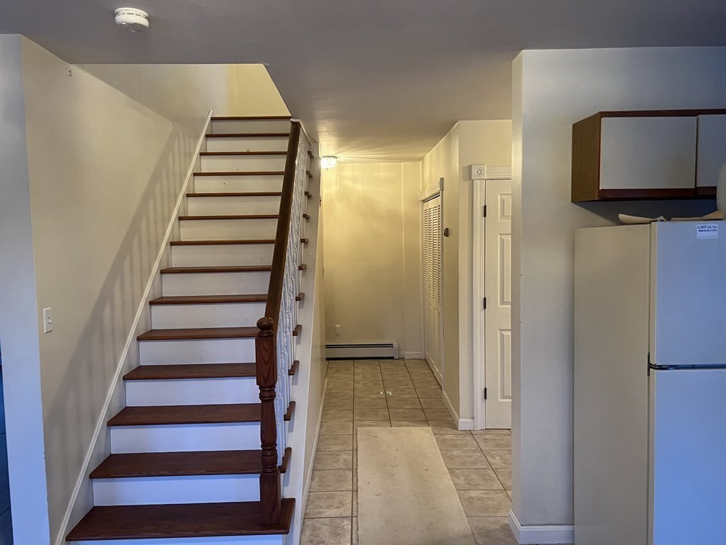7 South Charlton Shore Road Charlton, MA 01507 - Photo 18 of 42 a view of a hallway with front door wooden floor and stairs