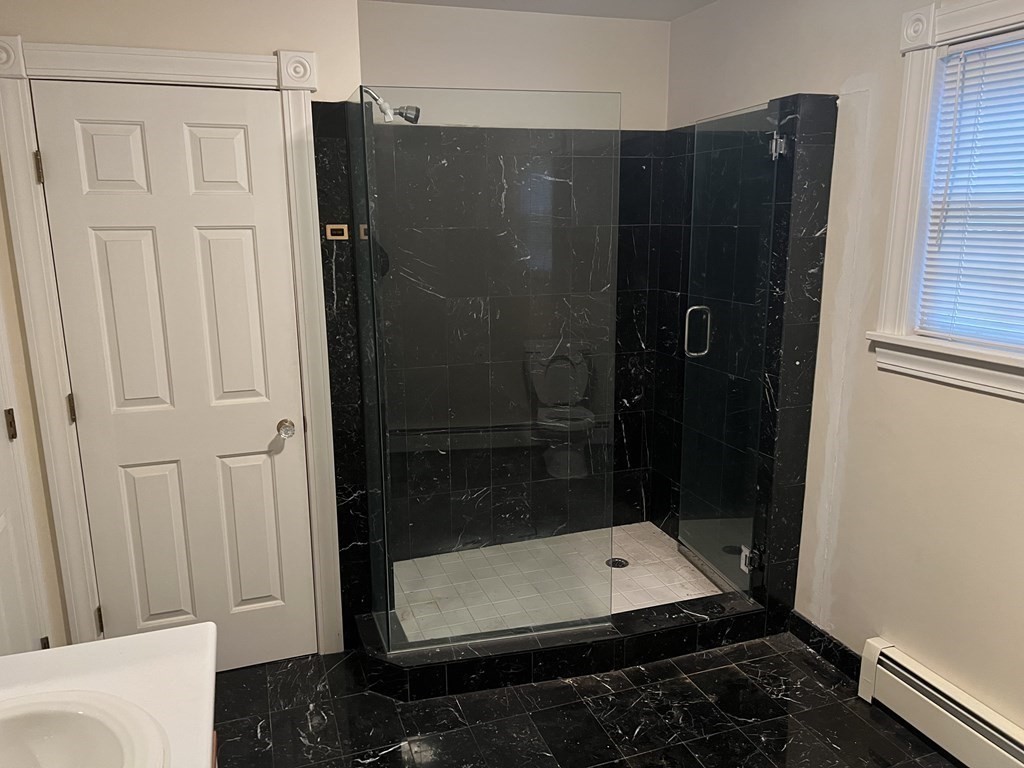 7 South Charlton Shore Road Charlton, MA 01507 - Photo 20 of 42 a bathroom with a glass shower door