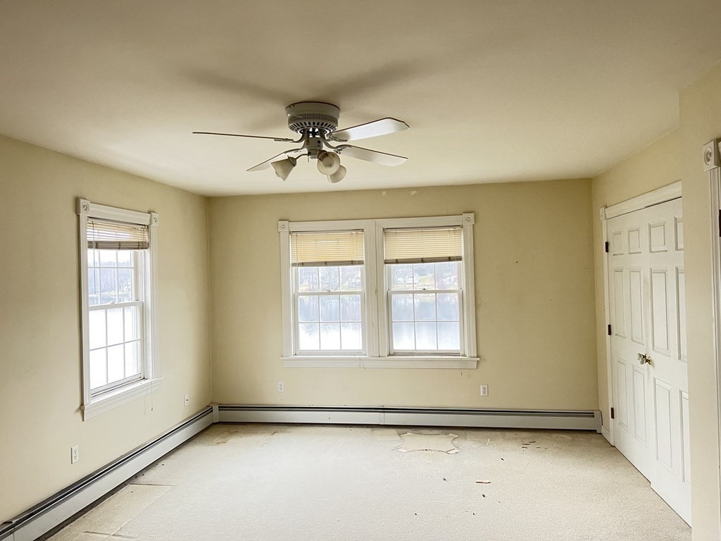 7 South Charlton Shore Road Charlton, MA 01507 - Photo 23 of 42 a view of an empty room with a window