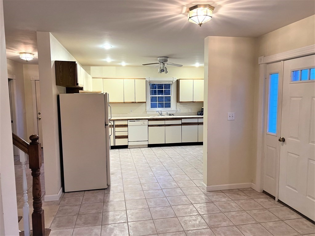 7 South Charlton Shore Road Charlton, MA 01507 - Photo 26 of 42 a large kitchen with cabinets and stainless steel appliances