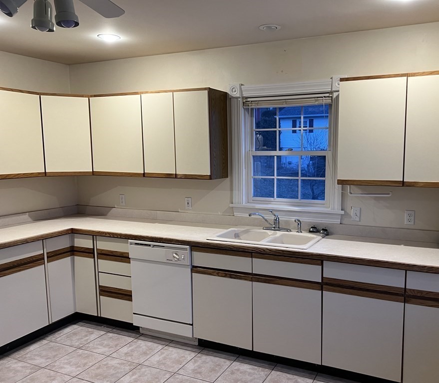 7 South Charlton Shore Road Charlton, MA 01507 - Photo 27 of 42 a kitchen with a sink and cabinets