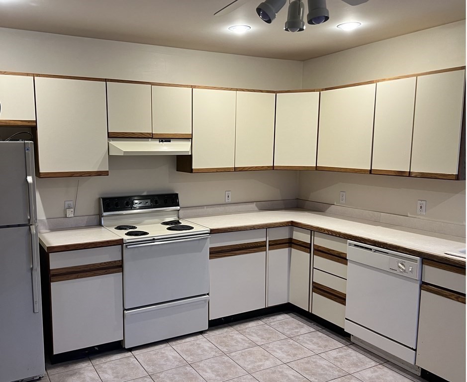 7 South Charlton Shore Road Charlton, MA 01507 - Photo 28 of 42 a kitchen with cabinets appliances and a sink