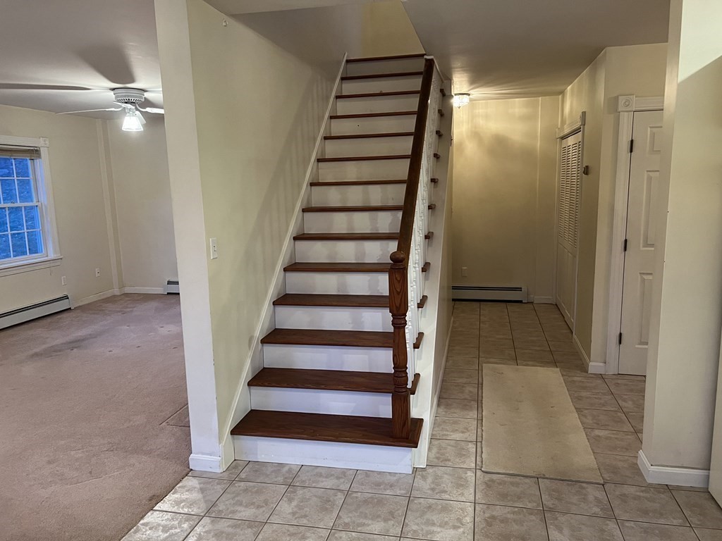 7 South Charlton Shore Road Charlton, MA 01507 - Photo 29 of 42 a view of entryway with stairs and wooden floor