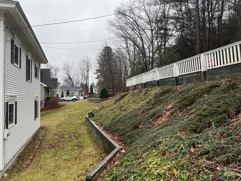 7 South Charlton Shore Road Charlton, MA 01507 - Photo 39 of 42 a view of a yard with yellow house