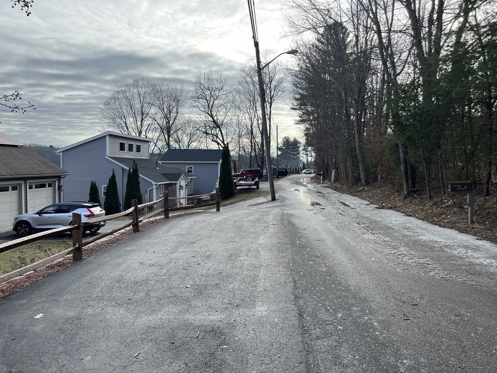 7 South Charlton Shore Road Charlton, MA 01507 - Photo 40 of 42 a view of a house with a snow in the yard