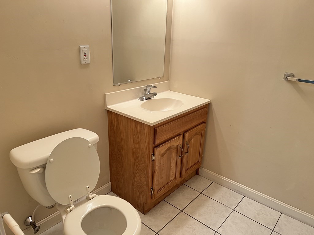 7 South Charlton Shore Road Charlton, MA 01507 - Photo 41 of 42 a bathroom with a sink a toilet and mirror