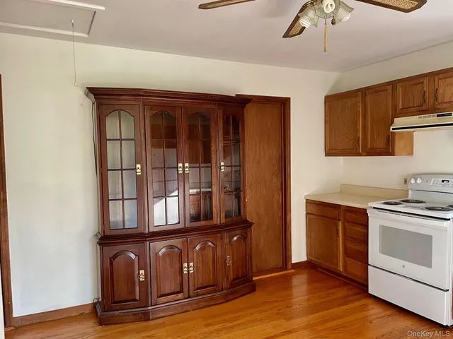 a kitchen with stainless steel appliances granite countertop a stove and a refrigerator