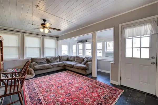 a living room with furniture and a rug