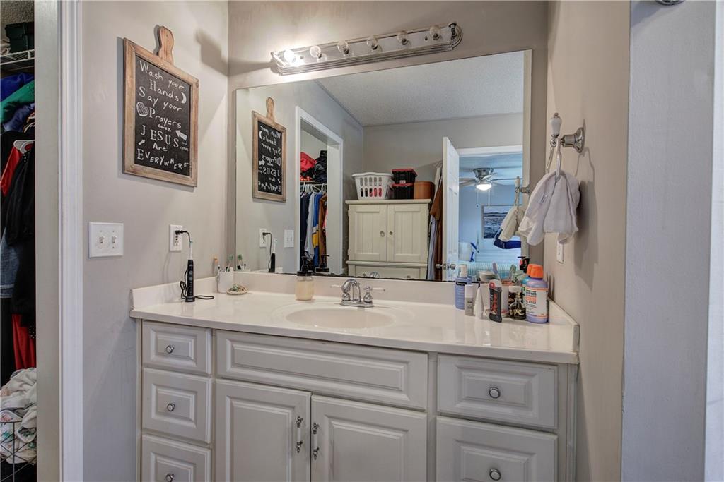 2023 Fate Conn Road Canton, GA 30114 - Photo 18 of 59 a bathroom with a sink and a mirror