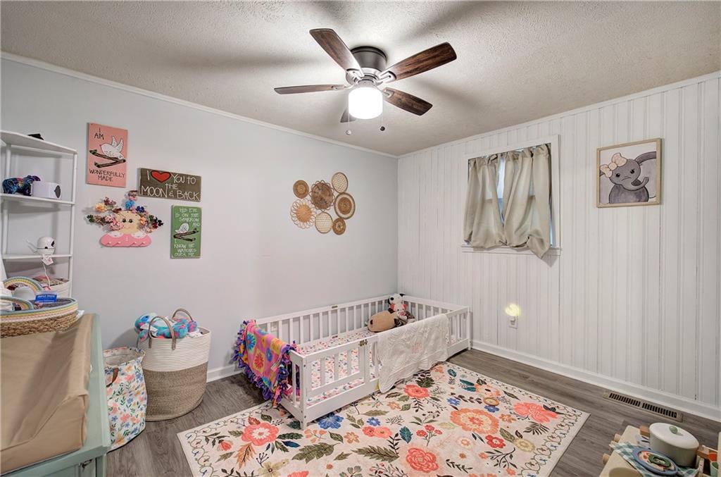 2023 Fate Conn Road Canton, GA 30114 - Photo 23 of 59 a bed room with a bed and a couch