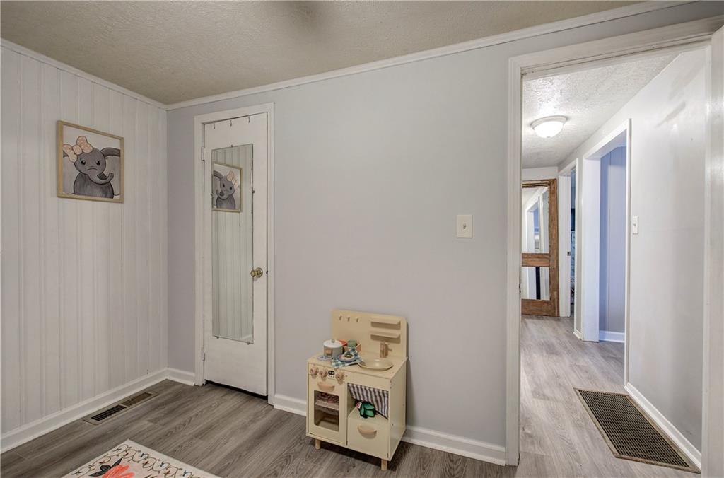 2023 Fate Conn Road Canton, GA 30114 - Photo 24 of 59 a view of an entryway with wooden floor